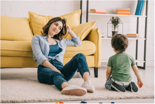 Tired mom playing with her kid