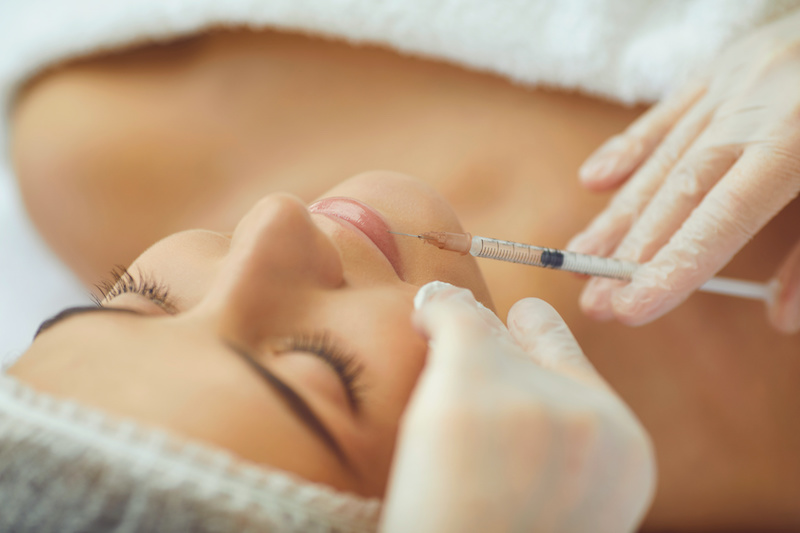 woman receiving botox facial injection